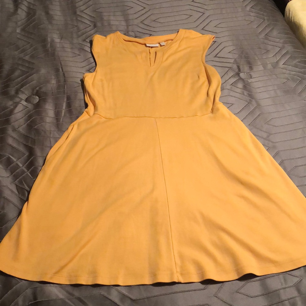 Gold New York and Company sleeveless dress with pockets.